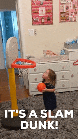Girl dunking toy basketball