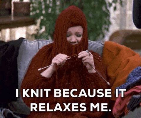 gif of woman knitting a sweater on herself, text says I knit because it relaxes me