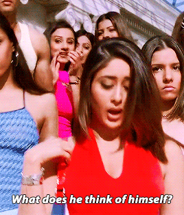 "What does he think of himself?" says an Indian woman in a red halter top as she descends down the stairs with a group of other women behind her.