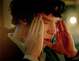 Benedict Cumberbatch breathing with hands pressed to his forehead.