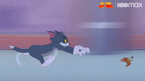 Tom running to catch Jerry.