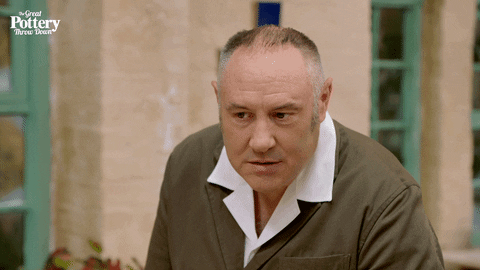 Animated GIF of a person raising a suspicious, sceptical eyebrow, representing the reaction to an agency asking about budget before goals
