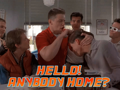 Back to the Future: Biff knocks on George McFly's head in the diner, with the words "Hello! Anybody home?"
