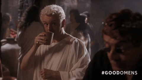 Aziraphale (Michael Sheen) and Crowley (David Tennant) drinking in ancient Rome