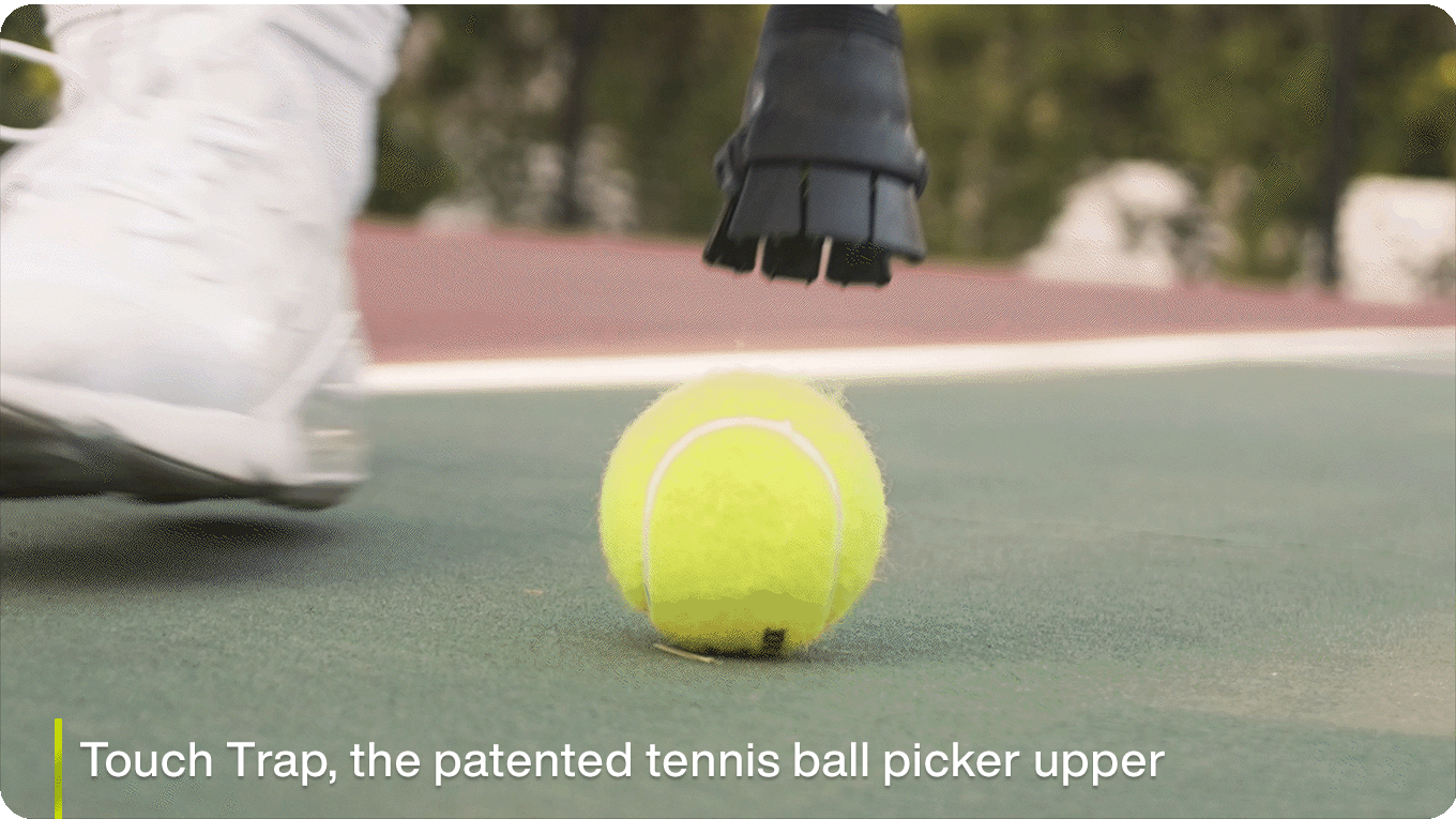 Ingenious tennis racquet grip attachment will pick up tennis balls off the ground for you