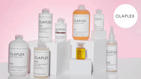 a gif of all the Olaplex products in front of a pink background