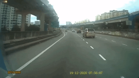 Watch: Motorcyclist Thrown Off Bike After Car Cuts Into Middle Lane & Crashes Into It On KESAS Highway