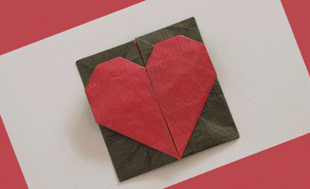 (A red paper mache heart opens and closes. The letter on the inside reads, "A thousand hearts would be too few to carry all my love for you.") Via Giphy