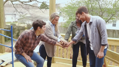 Gif of a team doing a group high-five 