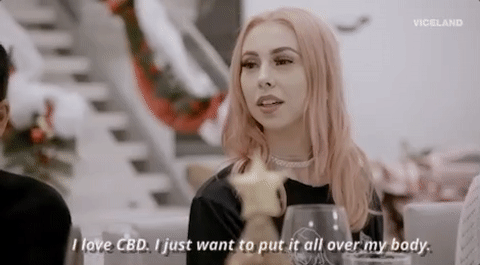 Woman with pink hair sharing how she uses CBD