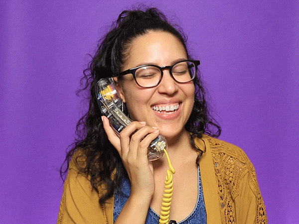 Woman laughing on telephone