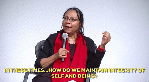 Animated GIF of Bell Hooks with caption IN THESE TIMES... HOW DO WE MAINTAIN INTEGRITY OF SELF AND BEING? sourced from Women's History GIPHY account