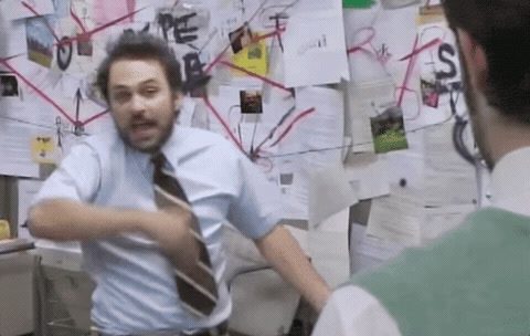 It's Always Sunny in Philadelphia: Charlie Kelly points wildly at a wall of papers joined by red string.