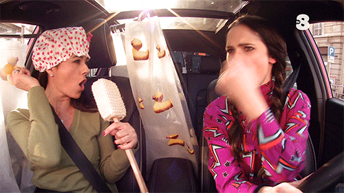 Two women singing in the car