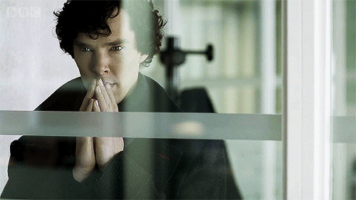 Benedict Cumberbatch, playing Sherlock Holmes, taps his fingers together