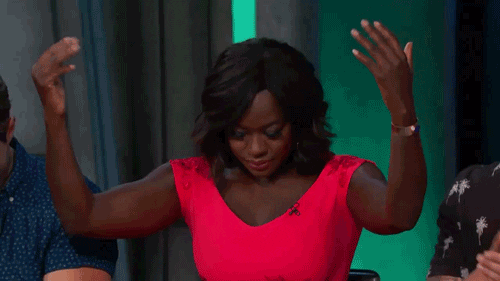 Viola Davis holding her hands up and motioning bring it to me