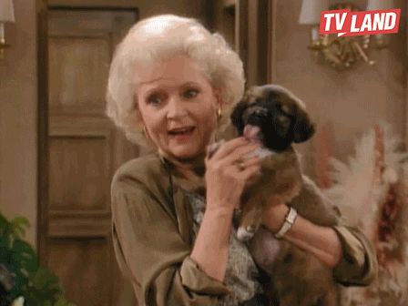 Gif of Betty White with a puppy