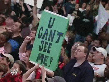 U Can't See Me! written on a green sign at a WWE match