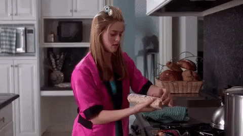Cher from Clueless throws a baked good on a tray
