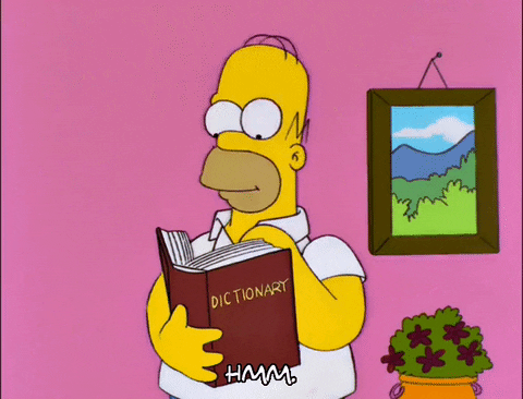 Homer Simpson looking through a dictionary.