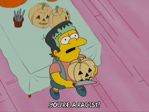 a GIF of Nelson from The Simpsons holding a pumpkin while exclaiming "you're a racist!"