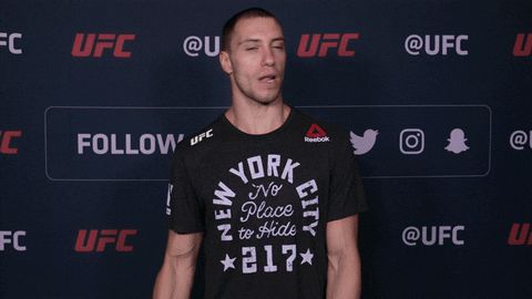 UFC gif of a guy waving the camera off saying "next"