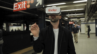 Man swiping on tinder with virtual reality headset on