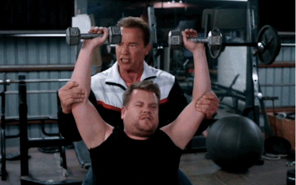 Arnold Schwarzenegger and James Corden working out