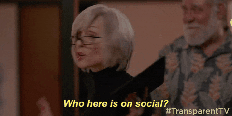 Giphy clip of older woman holding up an iPad saying "Who here is on social?"