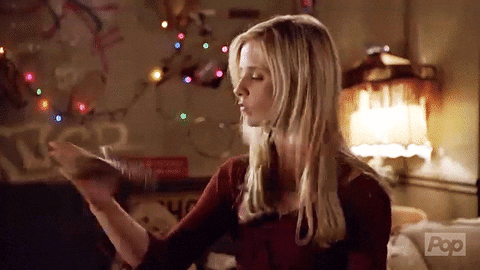 Buffy Summers twirling a wooden stake in her right hand