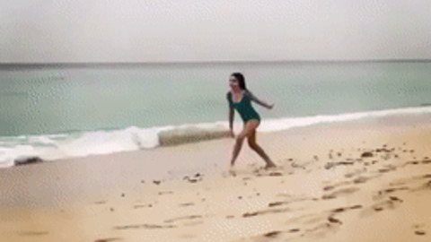 Girl fail jump in Beach