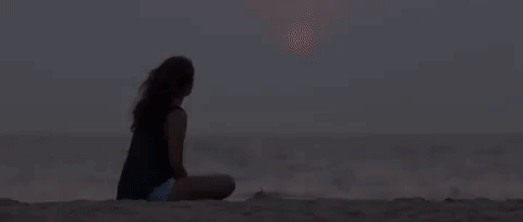 Image result for sad girl sitting at beach gif"