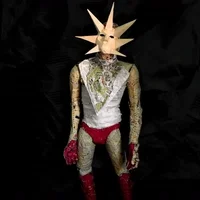 Figure in a spiked paper sun mask and a suit of printed paper, with red gloves