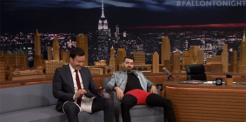 Jimmy Fallon & Joe Jonas sitting on a couch