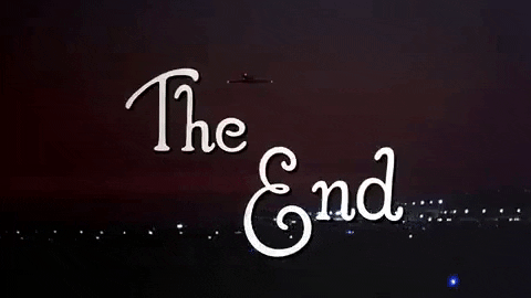 Night sky with fireworks booming behind the phrase "The End" written in white