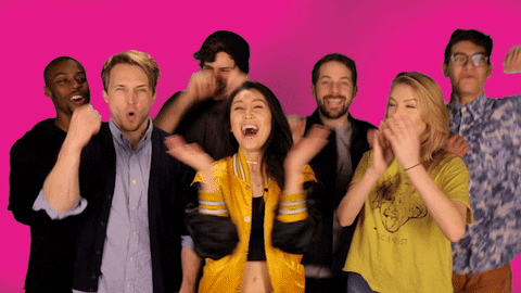 Collaboration gif: a group of 7 people cheering, clapping, and celebrating