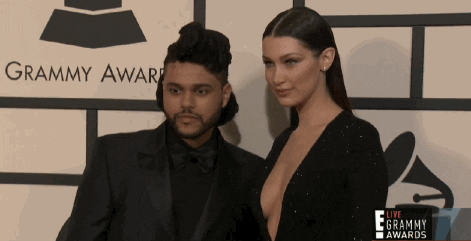 The Weeknd and Bella Hadid at a red carpet.