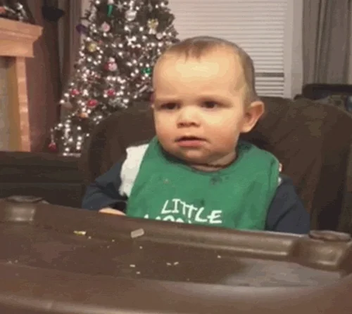 Skeptical baby giving a doubtful look