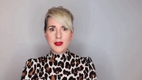 GIF of blonde haired woman wearing leopard print top pointing up and saying "You need to write for the context."
