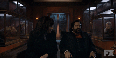 Gif from "What We Do in the Shadows" television show, Nadja & Laszlo shaking their heads/scoffing