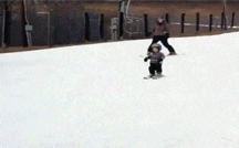 Child takes a spill while skiing