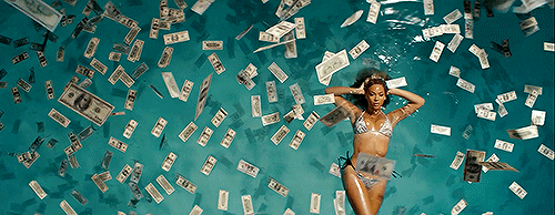 The singer Beyonce in a pool or money