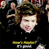 Harry Styles being interviewed on a red carpet. Harry Styles being interviewed on a red carpet.