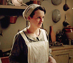 Daisy smiling and grabbing a pot