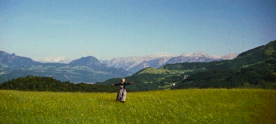 Gif of a woman dancing in a field -- teaching during quarantine