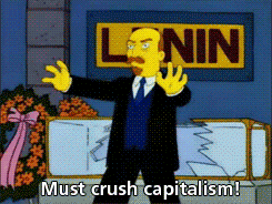 A GIF of a cartoon Vladimir Lenin lurching forward while saying 'Must crush capitalism!'