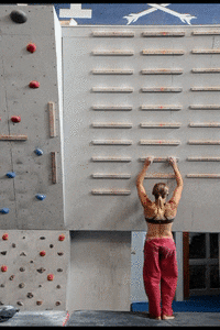 person climbing up the wall