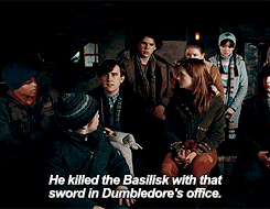 Neville sitting at a Dumbledore's Army meeting