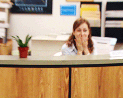 A GIF of Pam Beesly from the office smiling