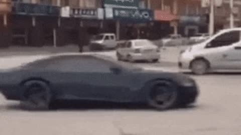 Showoff in middle of road gone wrong gif